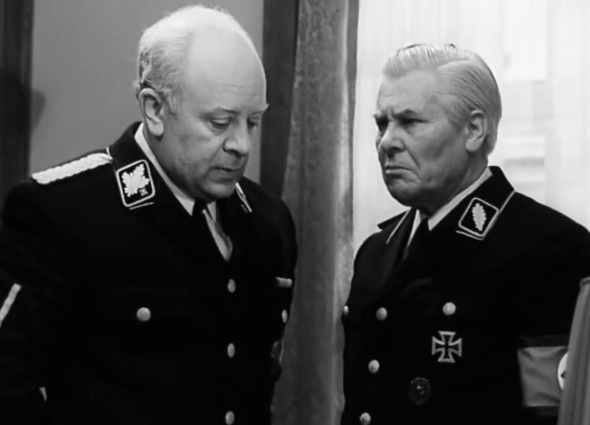 «Группенфюрер, штандартенфюрер Штирлиц идет по коридору». Генрих Мюллер (Леонид Броневой) и его секретарь Шольц (Лаврентий Масоха), «Семнадцать мгновений весны», 1973 год. Масоха скончался во время съемок сериала